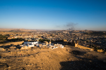 View of Marinid Tombs or Merenid Tombs and cemetery in Fez with old Fez medina in the background