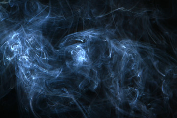 lovely swirl light bright smoke on heavy black background.