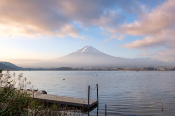 Scenic Mount Fuji and wooden port with colorful sky in Kawaguchiko lake