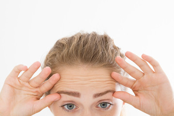 Macro Woman face with wrinkles on the forehead. Collagen and face injections concept. skin care....