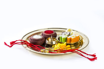 Raksha Bandhan rakhi with sweets diya and gift