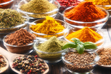 Variety of spices and herbs on kitchen table