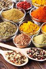 Variety of spices and herbs on kitchen table