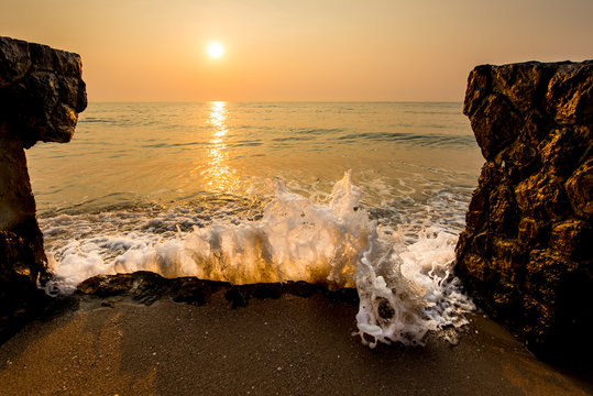 Ocean wave hit the shore in the morning.