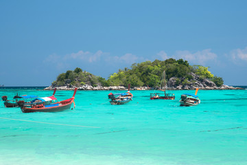 Fototapeta na wymiar Landscape view of beautiful beach and boat, sea sand sun at Lipe, Sa Toon province in south of Thailand with blue sky,white beach for relax, vacation,long holidays to driving scuba tropical Island