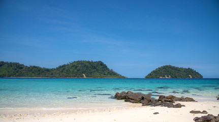 Landscape view of beautiful beach, sea sand sun at Lipe, Sa Toon province in south of Thailand with blue sky and white beach for relax, vacation and your long holidays to driving scuba tropical Island