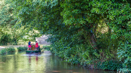 A picturesque journey in a barge on Brecon canal i near Talybont-on Usk n Wales, UK.