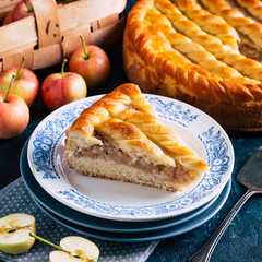 Apple pie on a blue background, sweet pastries, home cooking, piece, square