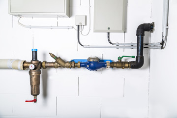 Water meter or manometer on metallic rusty water pipe