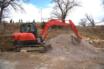 View of backhoe was digging a pit in the ground for rainwater,Crawler excavator truck ,Construction...