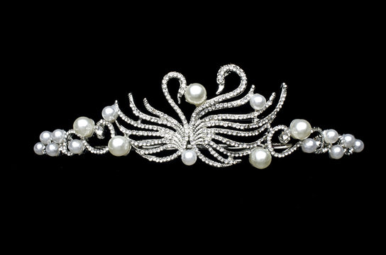 silver diadem with swans isolated on black