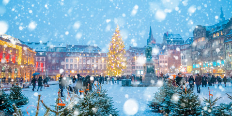 Christmas market under the snow in France, in Strasbourg, Alsace