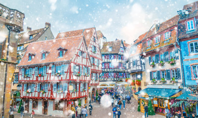 Christmas market under the snow in France, in Colmar near Strasbourg, Alsace - 218470483