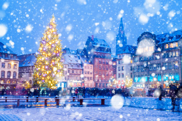 Christmas market under the snow in France, in Strasbourg, Alsace