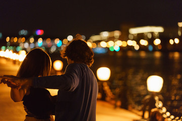 People dance on the embankment of Moscow river at the evening