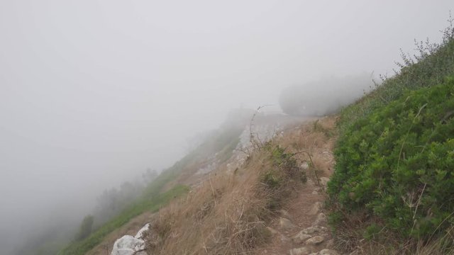 Strong fog and wind on mountain in a cludy day at Figueira da Foz, Portugal