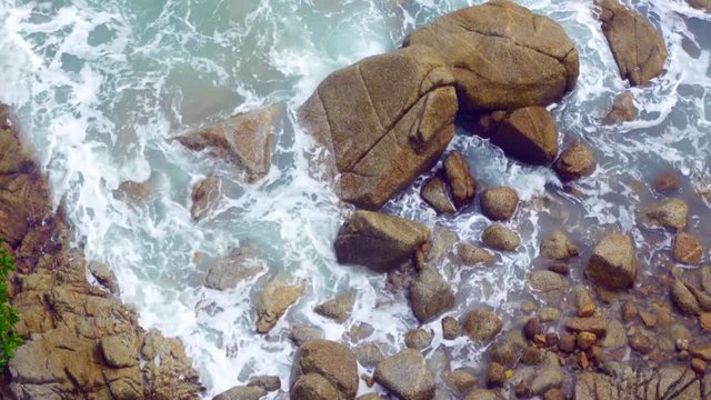 Natural Landscape view of sea wave in the andaman sea hit the rock in the sea near Sean shore in summer day time