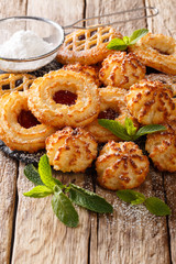 set of cookies rocher coco, couque and marimbas close-up. vertical