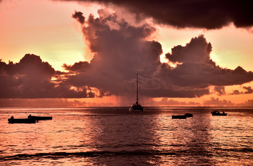 Glowing clouds on the beach of the Seychelles island of Mahe