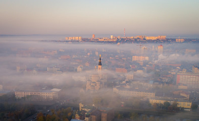 Fog above city of the center. Kharkiv churches are covered with the fog in the city center. Aerial view on the city of Kharkiv, Ukraine.