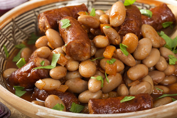 Beans stew wit pork sausages and tomato sauce