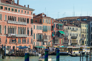 View of canal grande seen from the rialto Bridge, docked boats and architecture in Venice Italy 