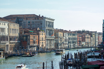 Fototapeta premium View of canal grande seen from the rialto Bridge, docked boats and architecture in Venice Italy 