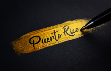 Puerto Rico Handwriting Text on Golden Paint Brush Stroke