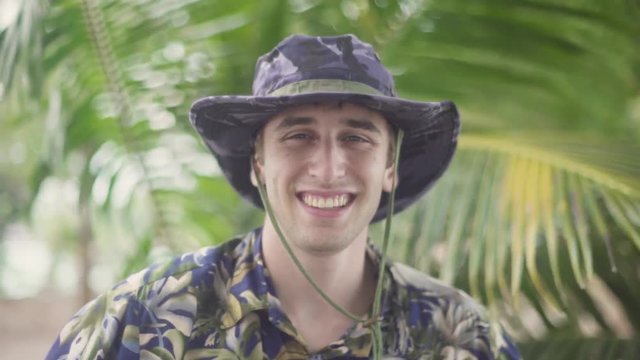Portrait of Steve Irwin Esque Man smiling into camera. Exploring Tropical Jungle