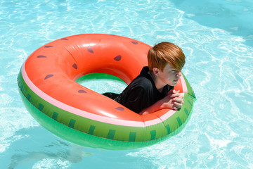 Teenage boy in floatie