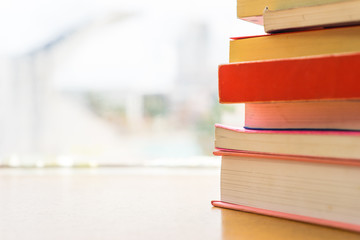 Pile of books on blur background