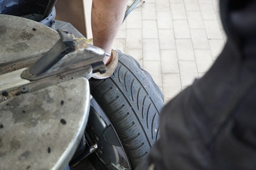 Tire changing in an auto repair shop