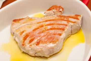 Tuna steak on a white plate