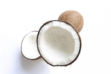 Coconut is separated from the hard shell. On white background for making coconut milk