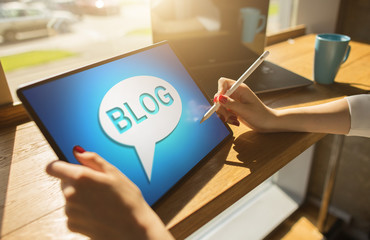 Tablet with BLOG text the on screen. Social network, Communication and internet marketing concept.