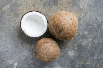 Coconut was piled on a concrete background. Used for coconut milk
