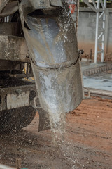 Obraz na płótnie Canvas Washing a concrete truck in construction site