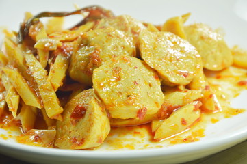 spicy stir fried bamboo shoot with pork ball curry on plate