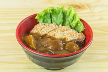 Tonkatsu, Japanese deep-fried pork cutlet on top with curry
