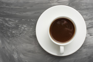 Black coffee on a dark texture