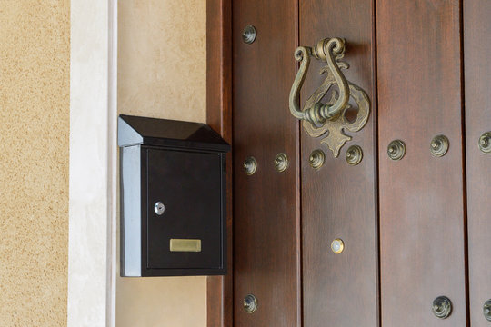 mailbox near the wooden door close-up
