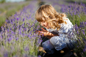 A Boy in a white hat having fun in lavender field