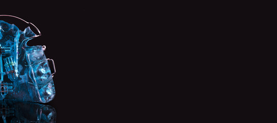 Ortodontic model brace or bracket. Close-up on black background. New dental technology. Modern color. Pleace for text or advertising