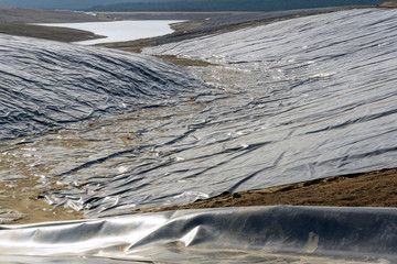 plastic underground waterproofing in the construction of a reservoir for the primary treatment of...