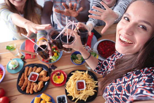 Group of people doing selfie during lunch. Self. Friends. Friends are photographed for eating