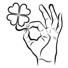 clover with four leaves in hand showing OK sign