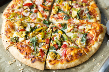 Pizza with chicken, bacon and vegetables 