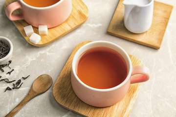 Cup of black tea on table
