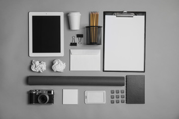 Flat lay composition with stationery on grey background. Mock up for design