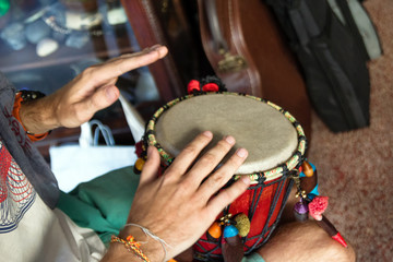 Naklejka premium Hands of man playing African drum or djembe. Chiang Mai, Thailand.